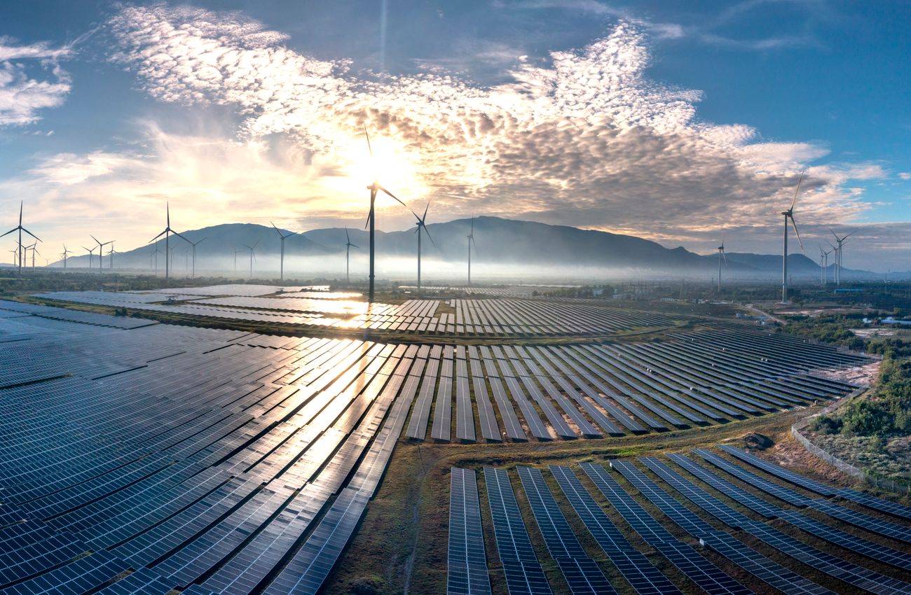 Frost on solar panels catching low sunrise light on a cold morning