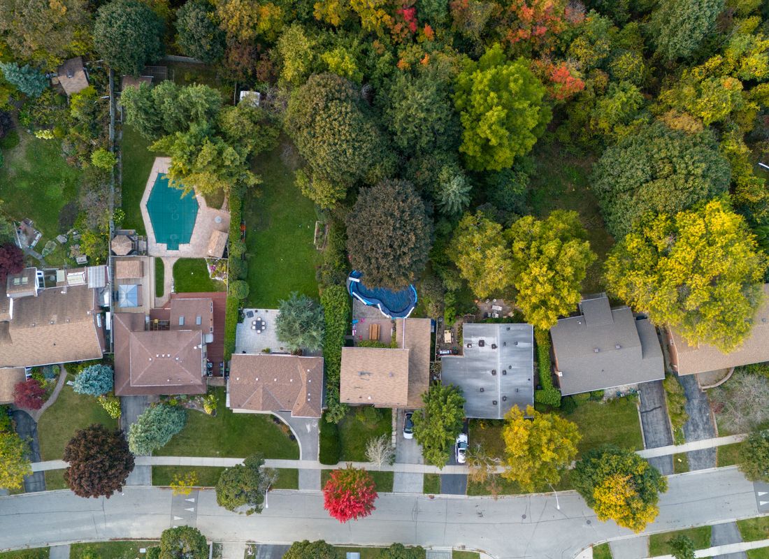 A residential street of Ontario homes among autumn trees